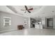 Open-concept living space flows into a modern kitchen with stainless appliances and gray cabinetry at 13524 Circa Crossing Dr, Lithia, FL 33547