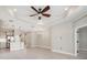 Open-concept living space with tiled floors, recessed lighting, and a modern ceiling fan at 13524 Circa Crossing Dr, Lithia, FL 33547