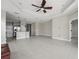 Bright open concept living space features tile flooring, a modern kitchen, and a dining area at 13524 Circa Crossing Dr, Lithia, FL 33547