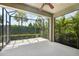 Enclosed patio with ample sunlight and tropical landscaping, perfect for outdoor relaxation and entertaining at 13524 Circa Crossing Dr, Lithia, FL 33547