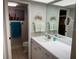 Bathroom with dual sinks and a separate toilet area at 140 Nina Way, Oldsmar, FL 34677