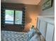Light and airy bedroom with beach-themed decor and natural light at 140 Nina Way, Oldsmar, FL 34677