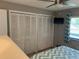 Bright bedroom featuring wall mounted tv at 140 Nina Way, Oldsmar, FL 34677