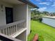 Balcony with a scenic view of the lush green lawn and pond at 140 Nina Way, Oldsmar, FL 34677