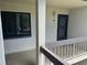 Apartment balcony with a view of the courtyard and landscaped grounds at 140 Nina Way, Oldsmar, FL 34677