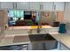 Kitchen with sink and countertop overlooking the living room area at 140 Nina Way, Oldsmar, FL 34677