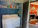 Updated laundry room with modern appliances and convenient access to the living area at 140 Nina Way, Oldsmar, FL 34677
