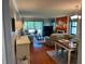 Inviting living room with hardwood floors, a fireplace and a dining area at 140 Nina Way, Oldsmar, FL 34677