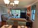 Open-concept living room with dining area and access to outdoor space at 140 Nina Way, Oldsmar, FL 34677