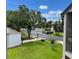 Peaceful neighborhood view with well-maintained lawns and mature trees at 140 Nina Way, Oldsmar, FL 34677