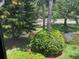 Scenic view of lush landscaping and a serene pond from the window at 140 Nina Way, Oldsmar, FL 34677
