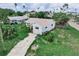 This property features a charming single-story home with a lawn in a pleasant neighborhood at 1580 Arizona Ave Ne, St Petersburg, FL 33703