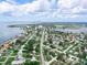 Aerial view of a waterfront community with easy access to the bay, under a sky with scattered fair-weather clouds at 1580 Arizona Ave Ne, St Petersburg, FL 33703