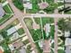 High-angle shot featuring a home on a landscaped lot with mature trees and residential neighborhood at 1580 Arizona Ave Ne, St Petersburg, FL 33703