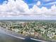 Waterfront community with many docks under scattered fair-weather clouds, showing easy access to Tampa Bay at 1580 Arizona Ave Ne, St Petersburg, FL 33703