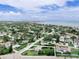 Aerial view with property outline showing well-maintained house on a green lot at 1580 Arizona Ave Ne, St Petersburg, FL 33703