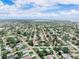 Drone photo captures homes nestled among verdant landscapes and winding streets at 1580 Arizona Ave Ne, St Petersburg, FL 33703
