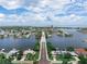 A scenic aerial view showcases a bridge with waterfront and neighborhood views in the distance at 1580 Arizona Ave Ne, St Petersburg, FL 33703