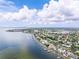 Expansive aerial view showcases waterfront homes with private docks and stunning Tampa skyline backdrop at 1580 Arizona Ave Ne, St Petersburg, FL 33703