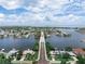 A scenic aerial view showcases a bridge with waterfront and neighborhood views in the distance at 1580 Arizona Ave Ne, St Petersburg, FL 33703