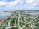 Aerial view of a waterfront community with easy access to the bay, under a sky with scattered fair-weather clouds at 1580 Arizona Ave Ne, St Petersburg, FL 33703
