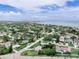Neighborhood aerial view featuring well-maintained homes with lawns near the coast at 1580 Arizona Ave Ne, St Petersburg, FL 33703