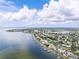 Aerial view of a waterfront community with access to the bay and skyline views on a sunny day with scattered fair-weather clouds at 1580 Arizona Ave Ne, St Petersburg, FL 33703