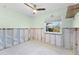Bedroom with a ceiling fan, a window, and unfinished walls at 1580 Arizona Ave Ne, St Petersburg, FL 33703
