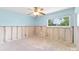 Bedroom with a ceiling fan, a window, and unfinished walls at 1580 Arizona Ave Ne, St Petersburg, FL 33703