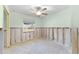 Bedroom with a ceiling fan, a window, and unfinished walls at 1580 Arizona Ave Ne, St Petersburg, FL 33703