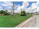 Modest single-story home with a lawn, shrubbery and an inviting neighborhood street at 1580 Arizona Ave Ne, St Petersburg, FL 33703