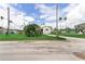 Charming single-story home with a front yard, sidewalk, and inviting neighborhood street at 1580 Arizona Ave Ne, St Petersburg, FL 33703