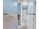 Hallway with blue walls, white doors, and unfinished floors at 1580 Arizona Ave Ne, St Petersburg, FL 33703
