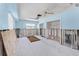 Unfinished living room with blue walls, concrete floor, and exposed studs at 1580 Arizona Ave Ne, St Petersburg, FL 33703