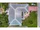 A bird's-eye view of a home's roof, driveway, and landscaping at 1607 New Bedford Dr, Sun City Center, FL 33573