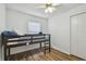 Bedroom with a bunk bed, wood-look floors, and closet at 17701 Sunrise Dr, Lutz, FL 33549