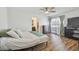 Large main bedroom features wood look floors, a ceiling fan, and an ensuite bathroom at 17701 Sunrise Dr, Lutz, FL 33549