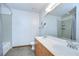 Bright bathroom with double vanity, sleek fixtures, and tiled floors, providing a clean and modern aesthetic at 2001 E 2Nd Ave # 12, Tampa, FL 33605