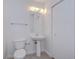 Clean, white bathroom with modern fixtures and a pedestal sink at 2001 E 2Nd Ave # 12, Tampa, FL 33605