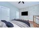 Modern bedroom showcases clean lines, exposed brick accents, and contemporary furnishings, creating a serene and inviting space at 2001 E 2Nd Ave # 12, Tampa, FL 33605