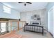 Stylish bedroom loft featuring modern decor, hardwood floors, and a cozy atmosphere with exposed brick accents at 2001 E 2Nd Ave # 12, Tampa, FL 33605