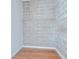 Empty closet showcasing exposed brick and wire shelves at 2001 E 2Nd Ave # 12, Tampa, FL 33605