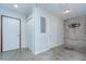 A room with white walls, closet, an electrical panel, and a mounted TV bracket at 2001 E 2Nd Ave # 12, Tampa, FL 33605