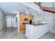 Efficient kitchen with bright wooden cabinets, granite counters, and stainless appliances at 2001 E 2Nd Ave # 12, Tampa, FL 33605
