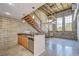 Modern kitchen with wooden cabinets, granite countertops, and stainless steel appliances at 2001 E 2Nd Ave # 12, Tampa, FL 33605