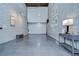 Bright living area featuring a large exposed brick wall at 2001 E 2Nd Ave # 12, Tampa, FL 33605