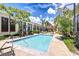 Community pool with lush landscaping and plenty of seating at 2001 E 2Nd Ave # 12, Tampa, FL 33605