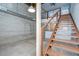 Unique staircase with wooden steps and metal railings, complemented by exposed brick walls and industrial accents at 2001 E 2Nd Ave # 12, Tampa, FL 33605