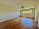 Bedroom with laminate flooring, ceiling fan, and windows providing ample natural light at 2341 Haitian Dr # 49, Clearwater, FL 33763