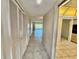 Hallway with tile flooring, multiple storage closets, and access to a living area at 2341 Haitian Dr # 49, Clearwater, FL 33763
